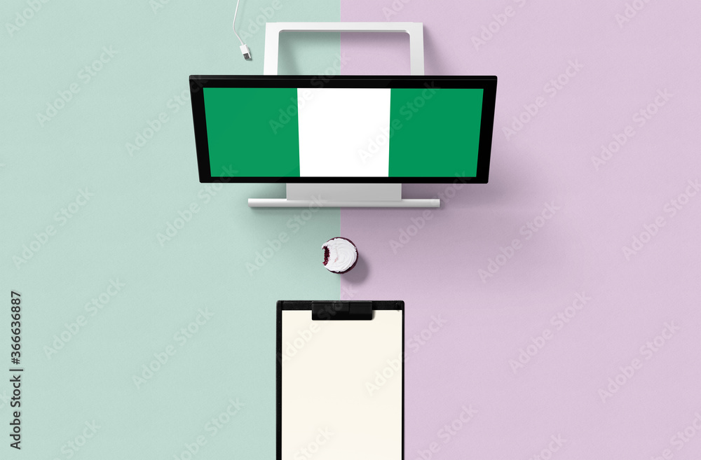 Wall mural Nigeria national flag on computer screen top view, cupcake and empty note paper for planning. Minimal concept with turquoise and purple background.