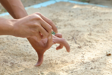 play glass marble on sandy ground
