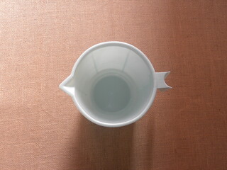 Top view of bluish white color plastic mug