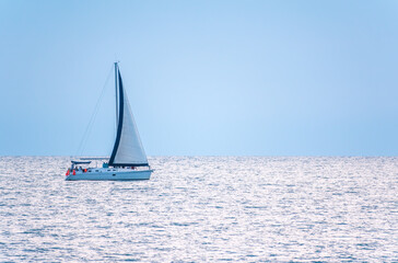 Fototapeta premium Sailing yacht in the blue calm sea.
