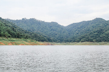 View at Kuhn Darn dam lake in Thailand.Beauty of nature concept background.Dramatic and picturesque scene.Mountain reflection on water.Popular tourist attraction. Exploration travel world.