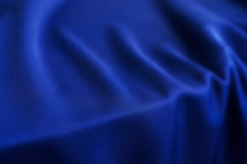 Blurred dark blue silk texture.