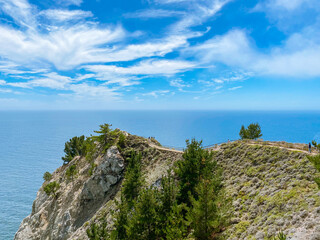 Seascape. The walkway leads to the observation deck. Summer, sunny day. Blue sky with white clouds. Muir woods beach overlook, California, USA