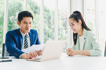 Obraz premium Managers and secretaries meeting and discussing business results from notebooks and paper charging statistics are in the company.