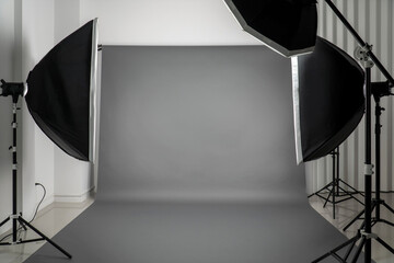 Photo studio with lighting equipment flash and softbox.