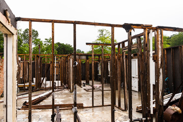 Ruined remains of house after being destroyed by fire.