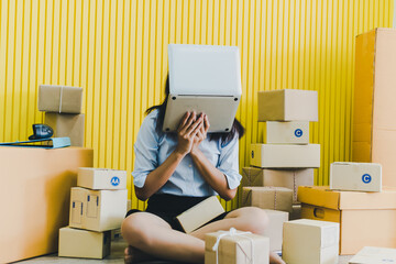 Asian women business owners to do their own small enterprise or call SME. She is checking the stock to deliver to the customer. Which she stressed.