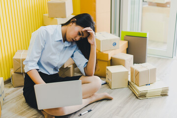 Asian women business owners to do their own small enterprise or call SME. She is checking the stock to deliver to the customer. Which she stressed.