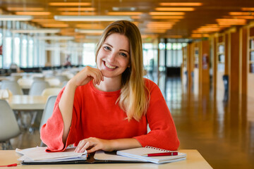 Young student studying in the library.