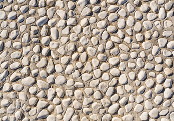 background made of a closeup of a wall with pebbles