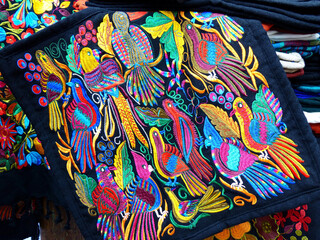 Close up of сolorful embroidered decorative textile from Otavalo city at the artisans market