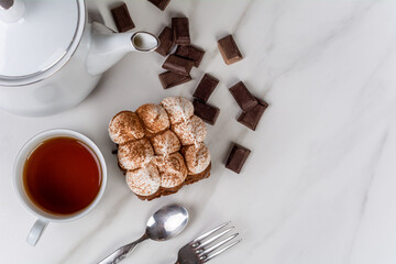 Mini chocolate cake with a cup of tea.