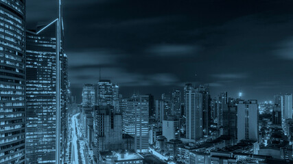 Bustling scene of Ayala Avenue and Makati Skyline at night, duri