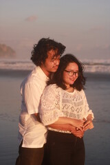 Young couple spending time together on beach.