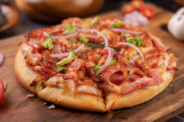 pizza placed on a wooden plate.