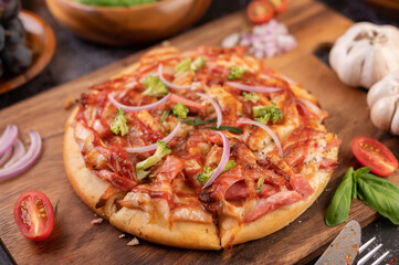 pizza placed on a wooden plate.