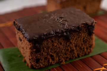 Chocolate cake on banana leaves.