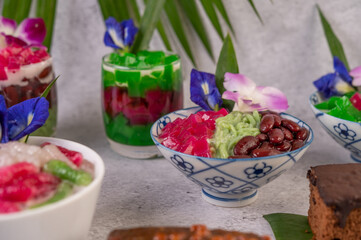 Desserts in cups placed on cement floor.