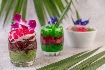 Dessert in a glass, placed on a cement floor.