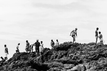 group of people walking in the mountains