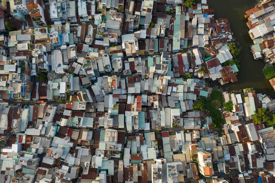 old residential and business area of Saigon Viietnam resembling a crowded shanty town built along a canal from aerial top down view