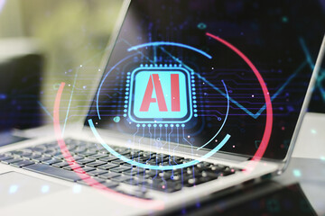 Double exposure of creative artificial Intelligence abbreviation with computer on background....