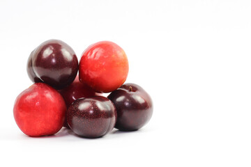 plums on white background