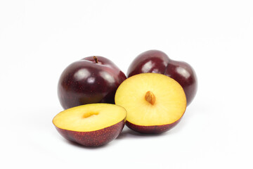 plums on white background