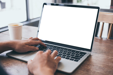 computer mockup image blank screen.hand man work using laptop with white background for advertising,contact business search information on desk at coffee shop.marketing and creative design