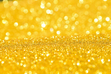 sparkles of golden glitter texture background
