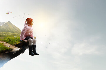 Dreamy little girl sitting ready for adventure