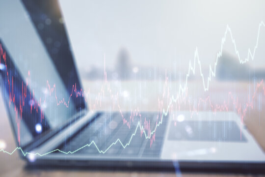 Double exposure of abstract creative financial diagram on modern laptop background, banking and accounting concept - Powered by Adobe