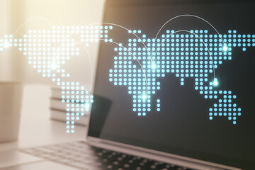 Abstract creative world map with connections on modern laptop background, international trading concept. Multiexposure
