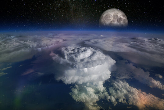 Landscape from space, with huge hurricane birth clouds and starry sky and moonrise. Elements of this image furnished by NASA.