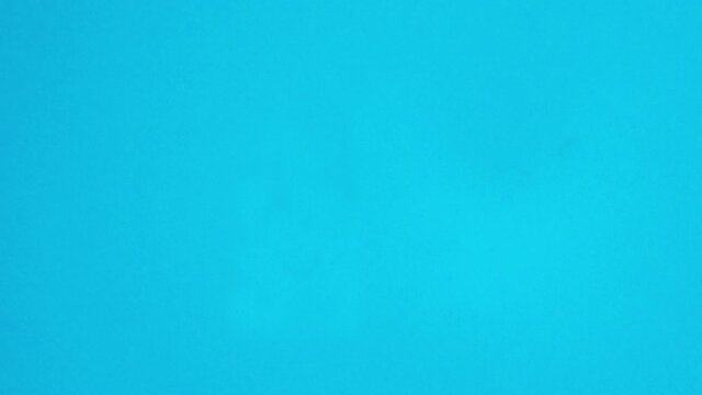 Stop Motion of a cigarette lighter on a blue background