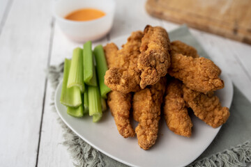 Chicken Fingers dinner, breaded tenders with sauce