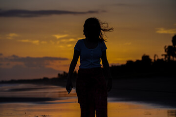 Beautiful silhouette image of Kids playing and enjoying at the Beach in Costa Rica