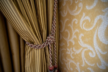 window curtain with ties on a yellow background