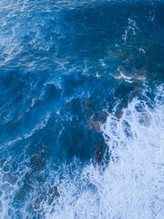 Fototapeta na wymiar Blue water and white wave foam.