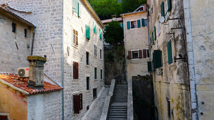 Fototapeta na wymiar Beautiful elements of old cities in Montenegro. Old town, street, houses windows.