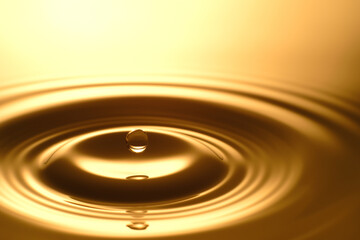 Water Drop - Pure clear and transparent of water and ripple in gold background. Creative modern...