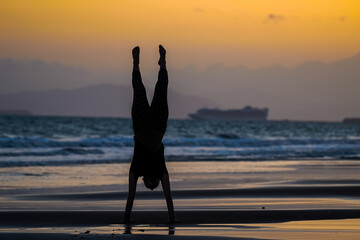 Fototapeta premium Beautiful silhouette image of Kids playing and enjoying at the Beach in Costa Rica