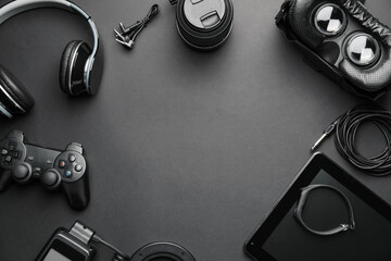 Frame made of different modern devices on dark background