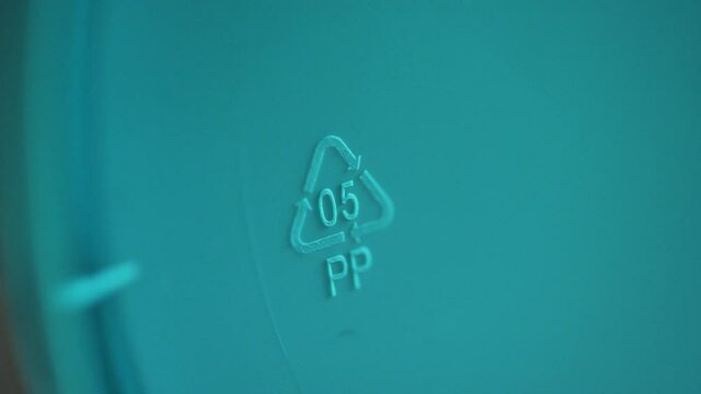 closeup polypropylene recycle label. Spbd macro shot of 0,5 pp sign and arrows. ecological emblem. marking code, packaging goods. waste pollution environment concept