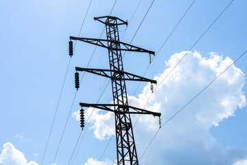 high voltage wires against the blue sky