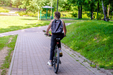 Cyclist ride on the bike path in the city Park
