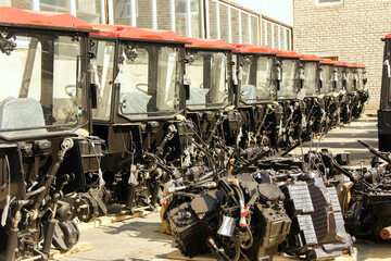 Obraz premium Tractors and cab harvesters. Agricultural machinery at the assembly plant