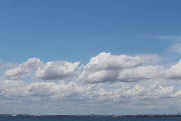 Fototapeta na wymiar Blue sky, clouds and horizon. Silver Beach Sydney.