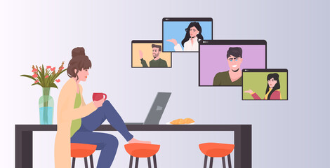 Fototapeta premium woman chatting with friends during video call people having online conference meeting communication concept kitchen interior horizontal vector illustration