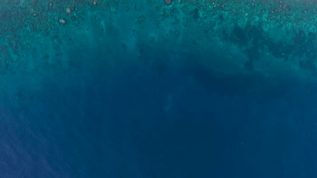 Amazing ocean water of Amed bay. Indonesia, Bali. Aerial view